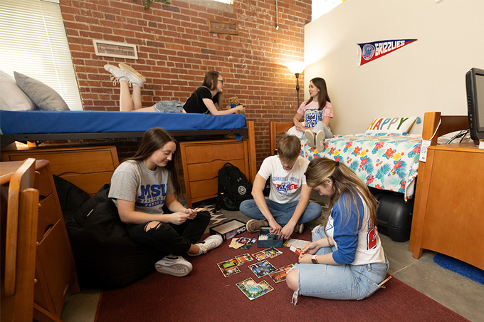 Group of students hanging out in a Grizzly Lofts room