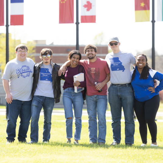 Students stand in the Commons for a photo