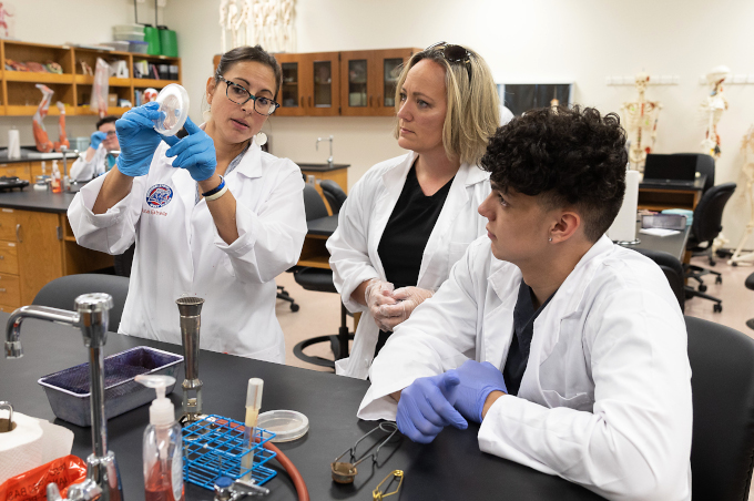 Faculty member working with students during class